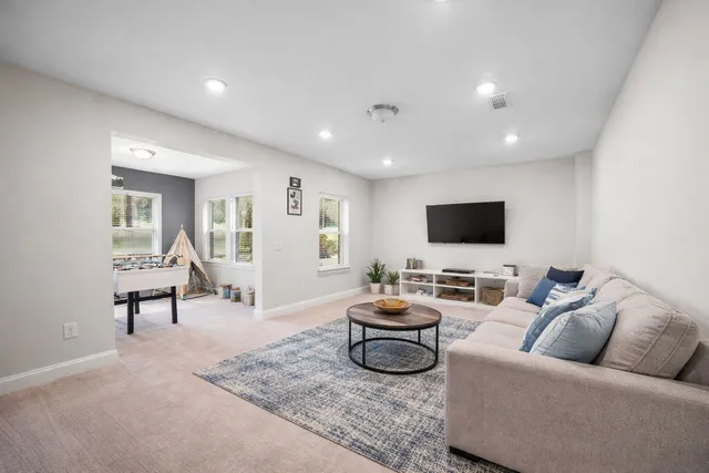 a view of a patio with table and chairs under an umbrella