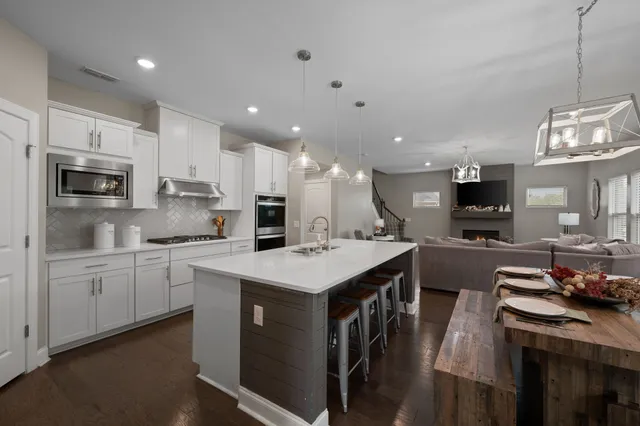 a kitchen with a sink stove and refrigerator