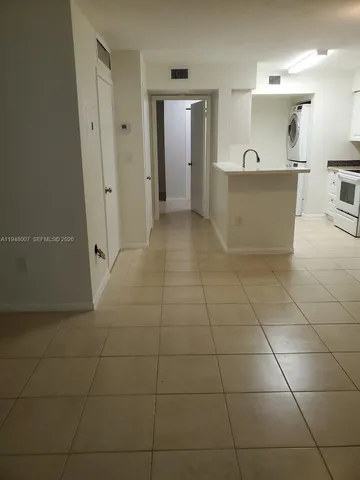 a view of a bathroom with a bathtub and a sink