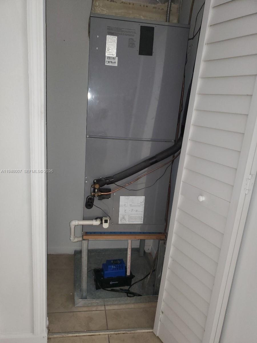 15241 Southwest 80th Street, Unit 307 Miami, FL 33193 - Photo 10 of 11 a bathroom with a sink and a mirror