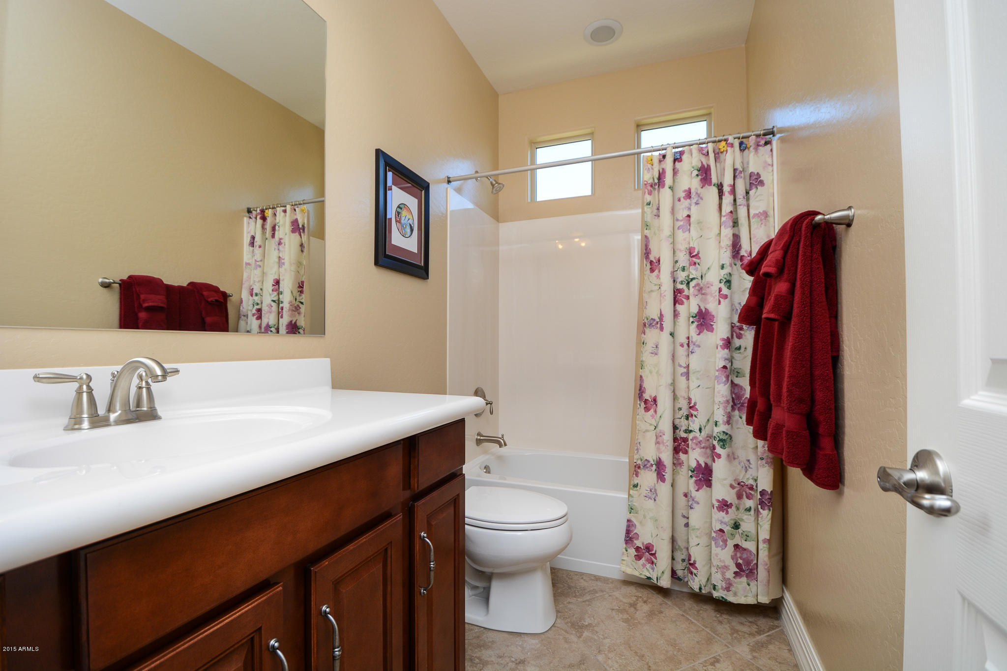 7545 West Redbird Road Peoria, AZ 85383 - Photo 13 of 23 a bathroom with a sink toilet and shower