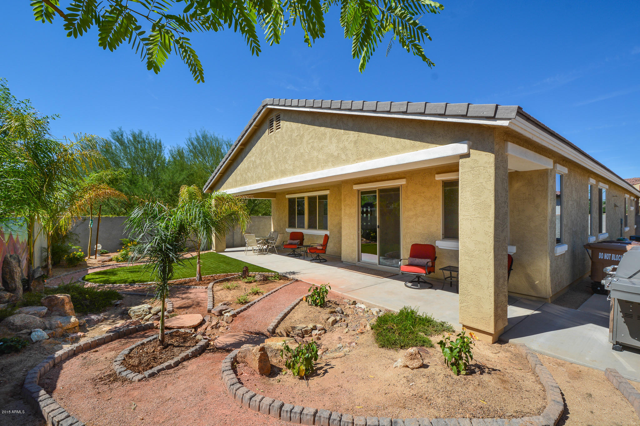 7545 West Redbird Road Peoria, AZ 85383 - Photo 15 of 23 a view of a house with backyard