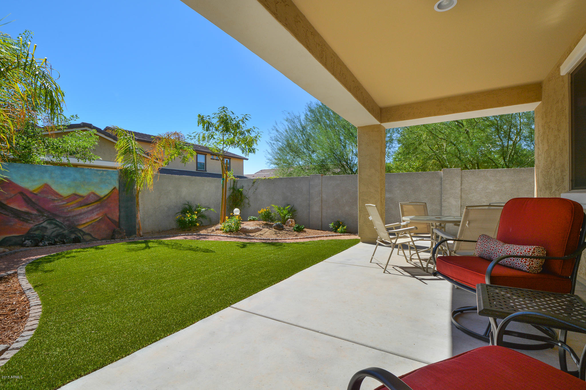 7545 West Redbird Road Peoria, AZ 85383 - Photo 16 of 23 a view of a patio with table and chairs and potted plants