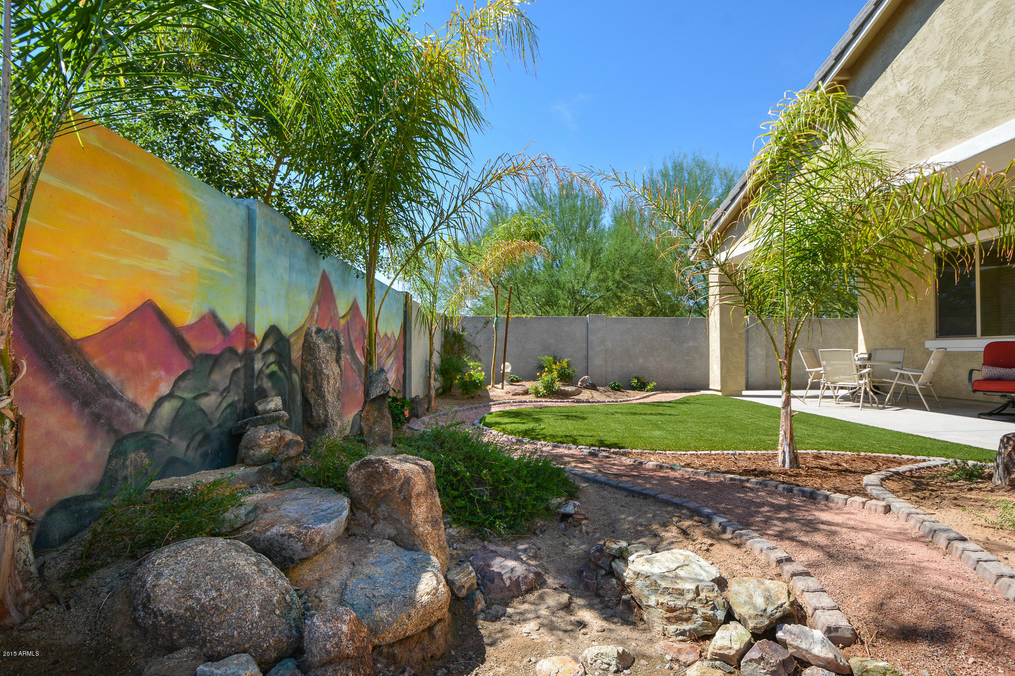 7545 West Redbird Road Peoria, AZ 85383 - Photo 18 of 23 a view of backyard with green space