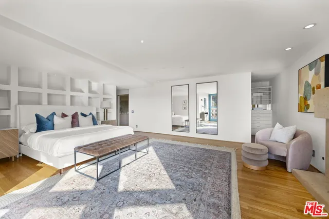 a living room with furniture and white walls