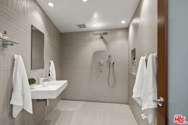 a living room with furniture a rug and a table