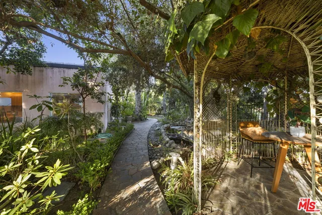 a kitchen with a stove and white cabinets