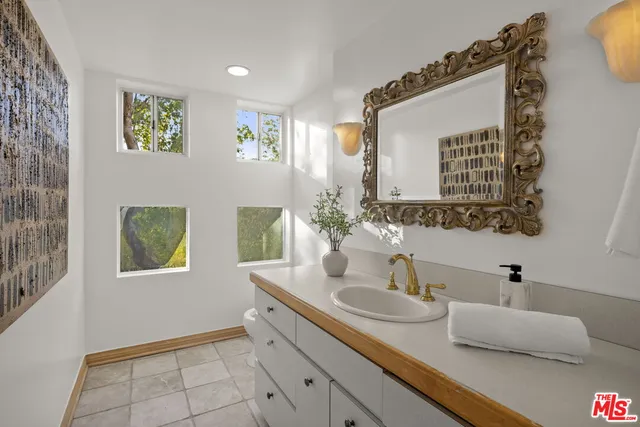 a view of a balcony with wooden floor and fence