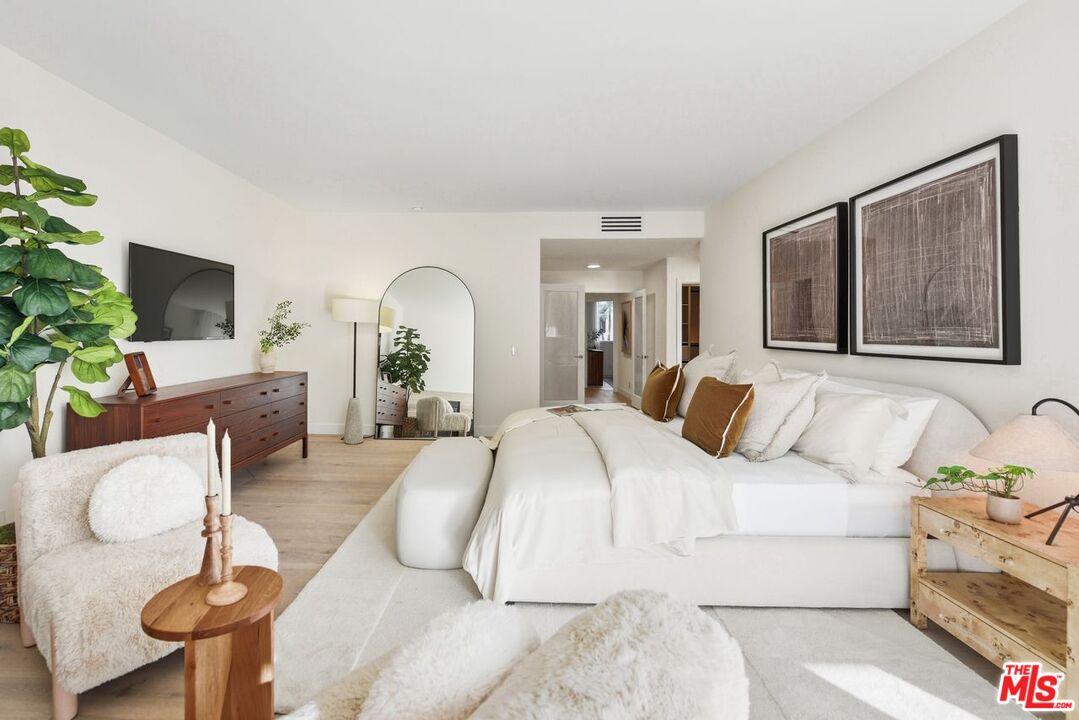 6487 Cavalleri Road, Unit 333 Malibu, CA 90265 - Photo 4 of 14 a bed room with a bed and a chair