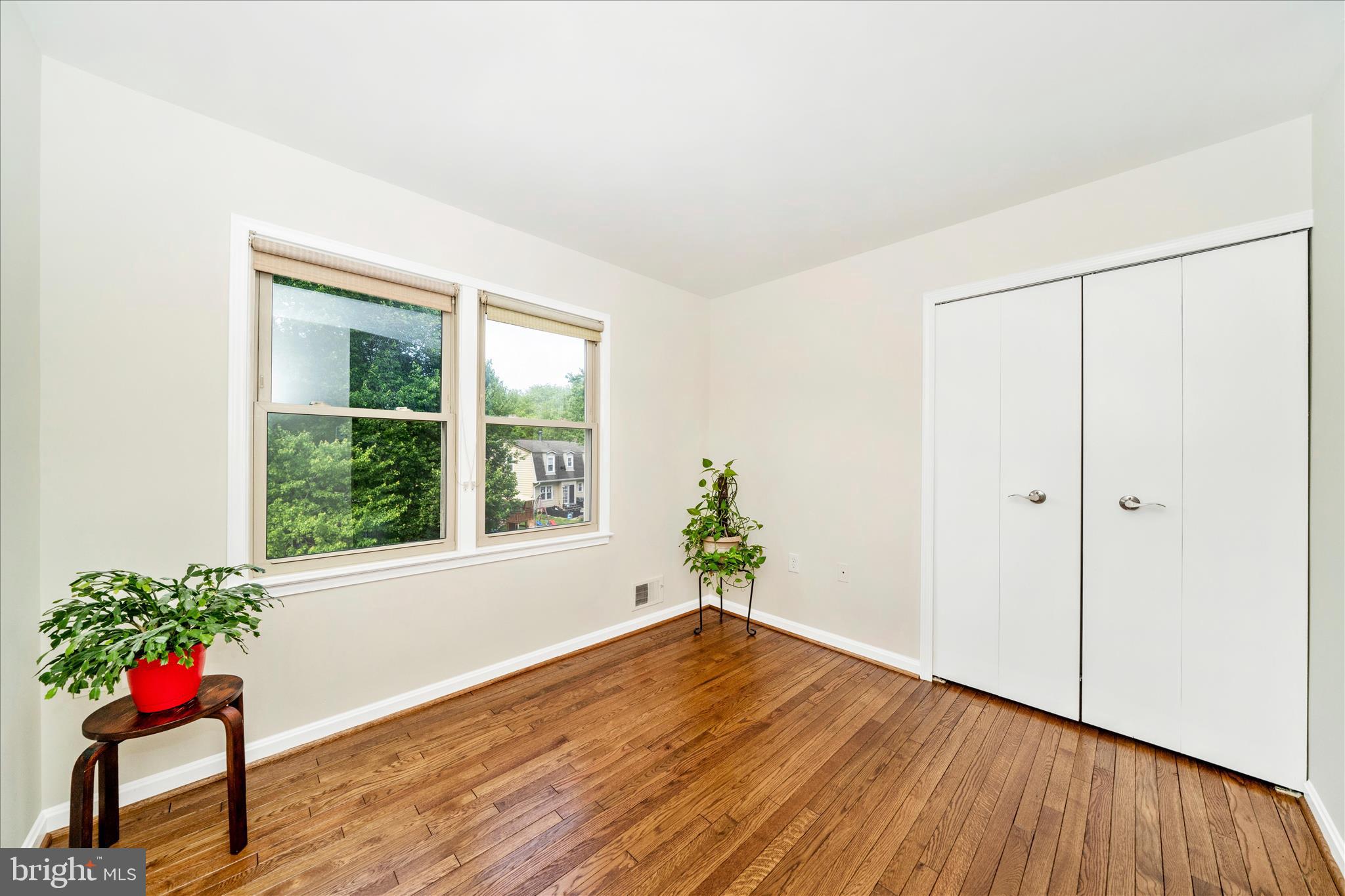 16000 Narrows Terrace Silver Spring, MD 20906 - Photo 25 of 54 a view of an empty room with wooden floor and a window