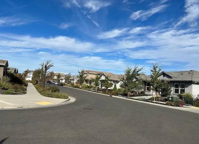 a view of a street with cars