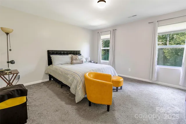 a bedroom with a bed and ceiling fan