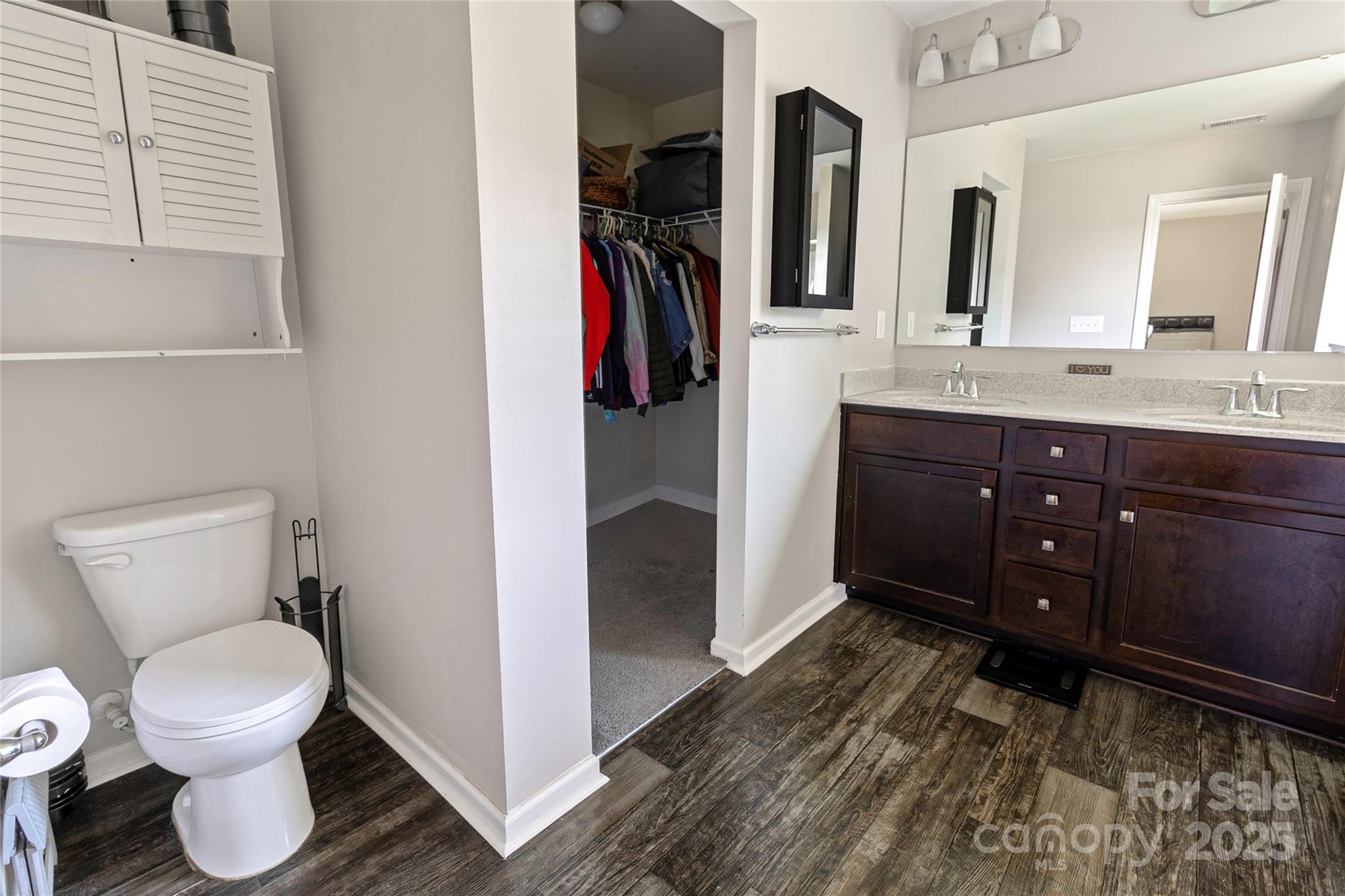 7017 Whitewater Loop Lowell, NC 28098 - Photo 12 of 24 a bathroom with a toilet sink and mirror