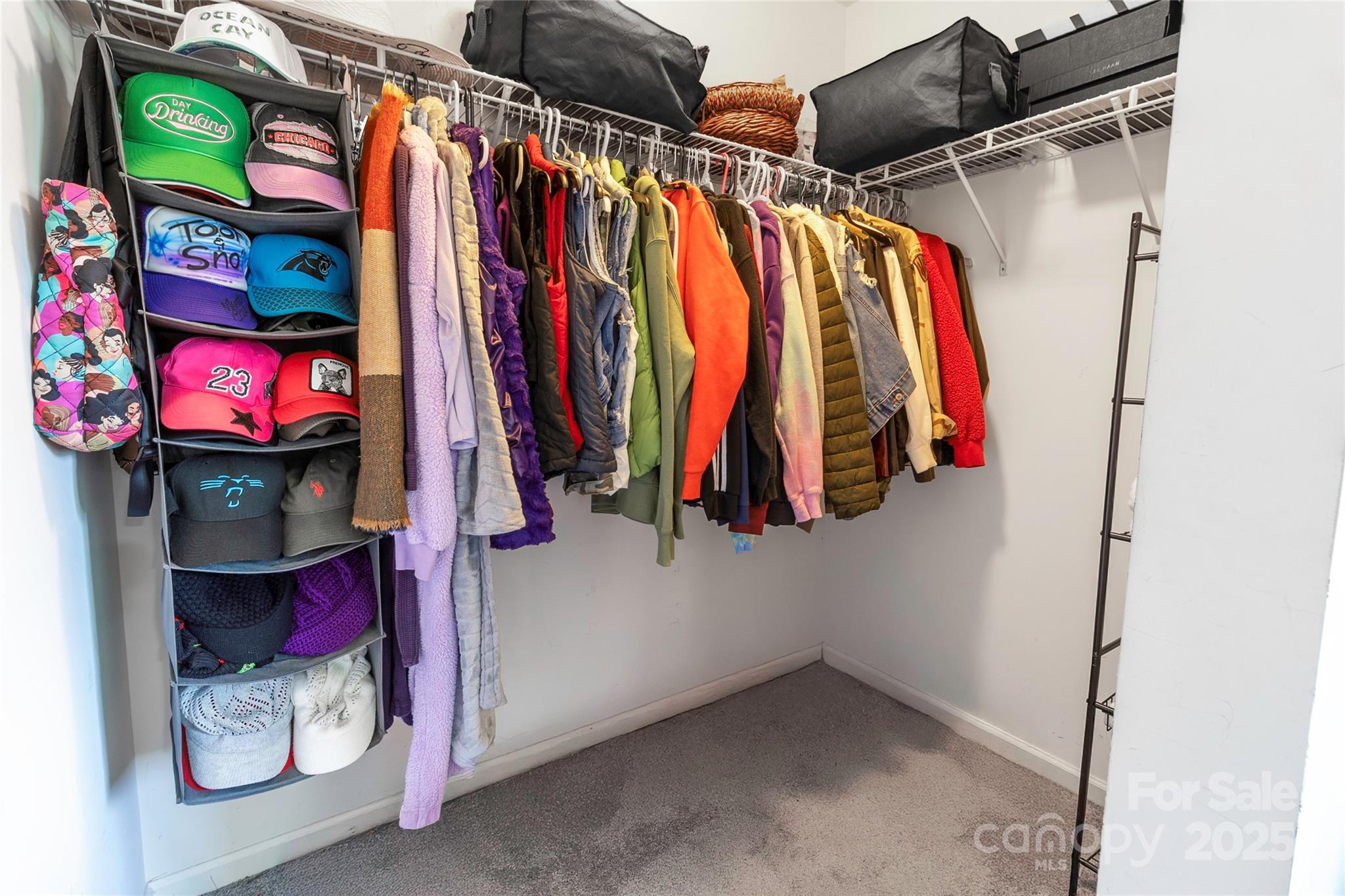 7017 Whitewater Loop Lowell, NC 28098 - Photo 14 of 24 a view of walk in closet with clothes and shoes