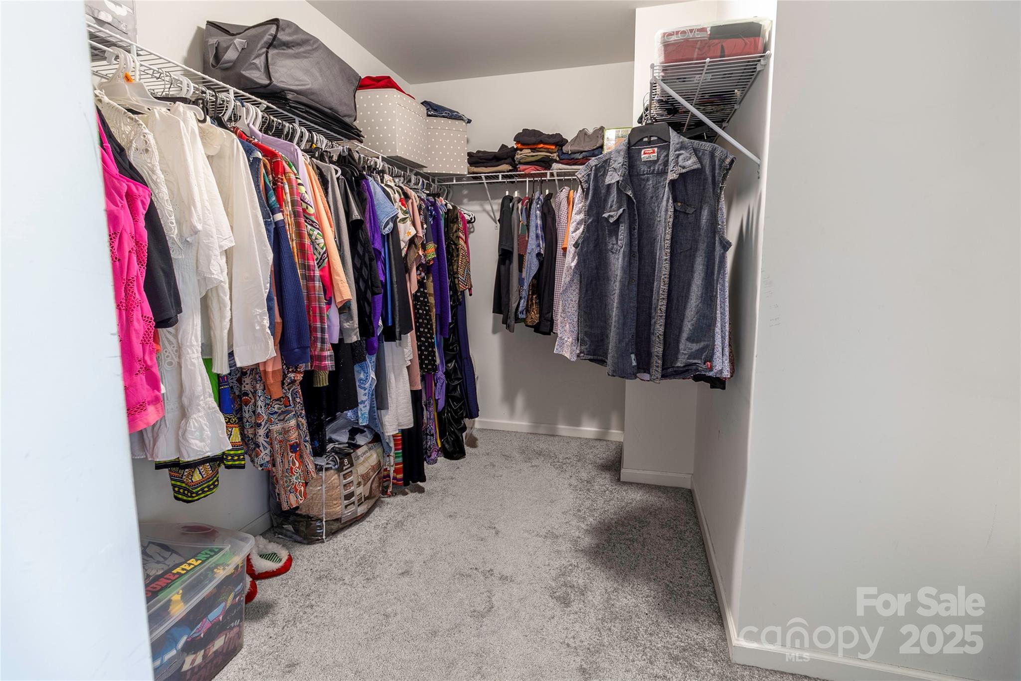 7017 Whitewater Loop Lowell, NC 28098 - Photo 15 of 24 a view of walk in closet with clothes