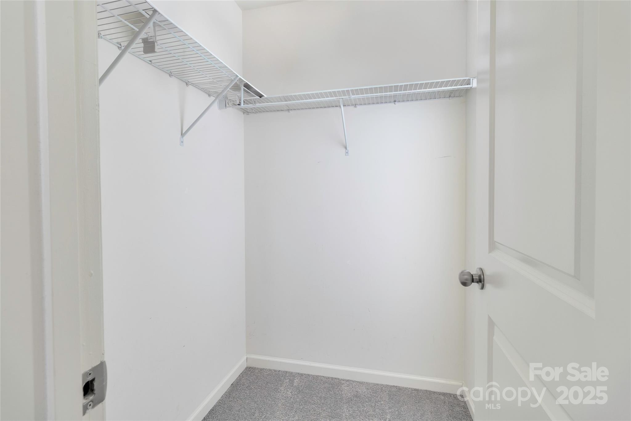 7017 Whitewater Loop Lowell, NC 28098 - Photo 17 of 24 a view of a room with racks on the wall