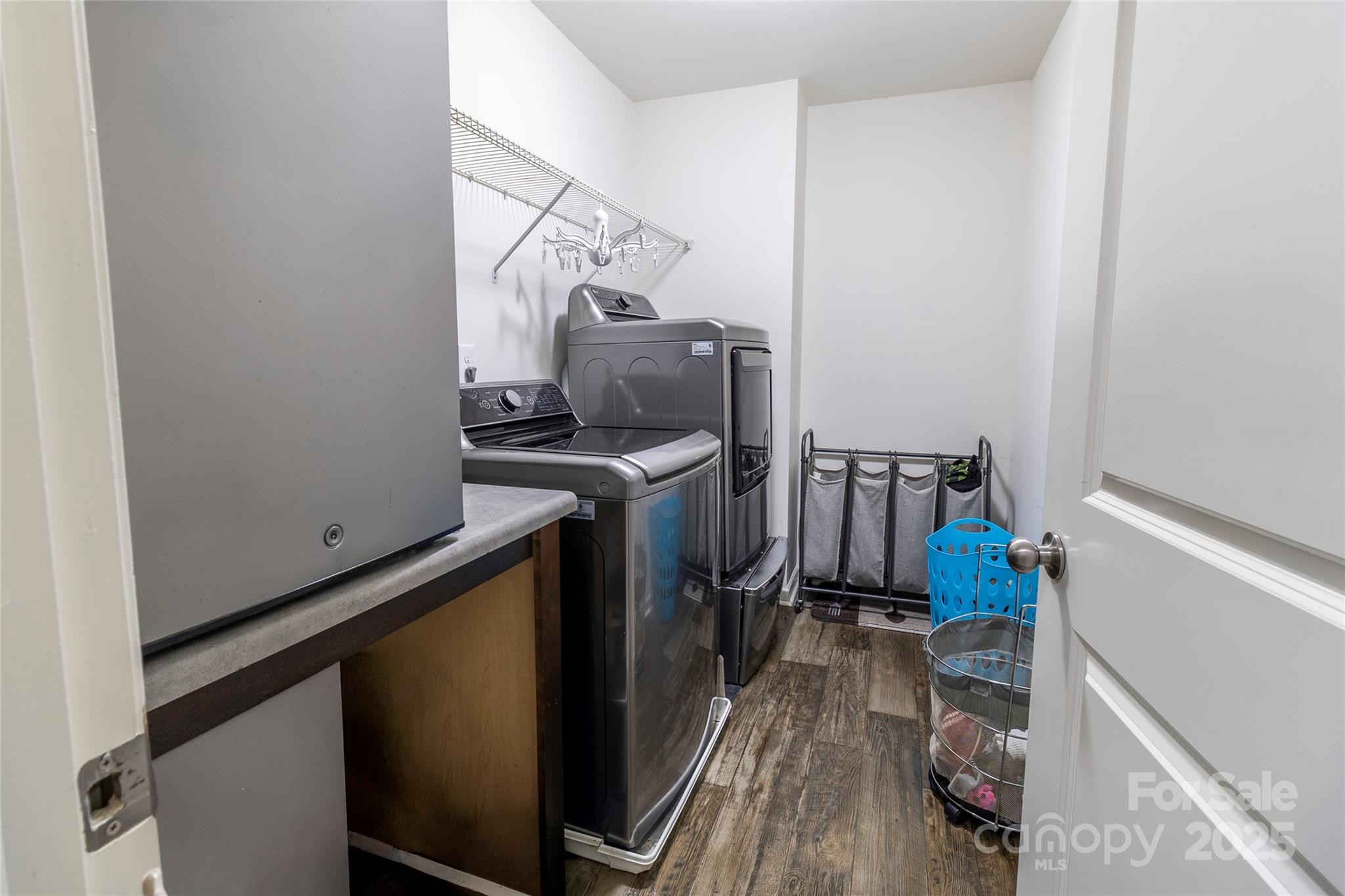 7017 Whitewater Loop Lowell, NC 28098 - Photo 20 of 24 a view of a storage and utility room with two washing machine