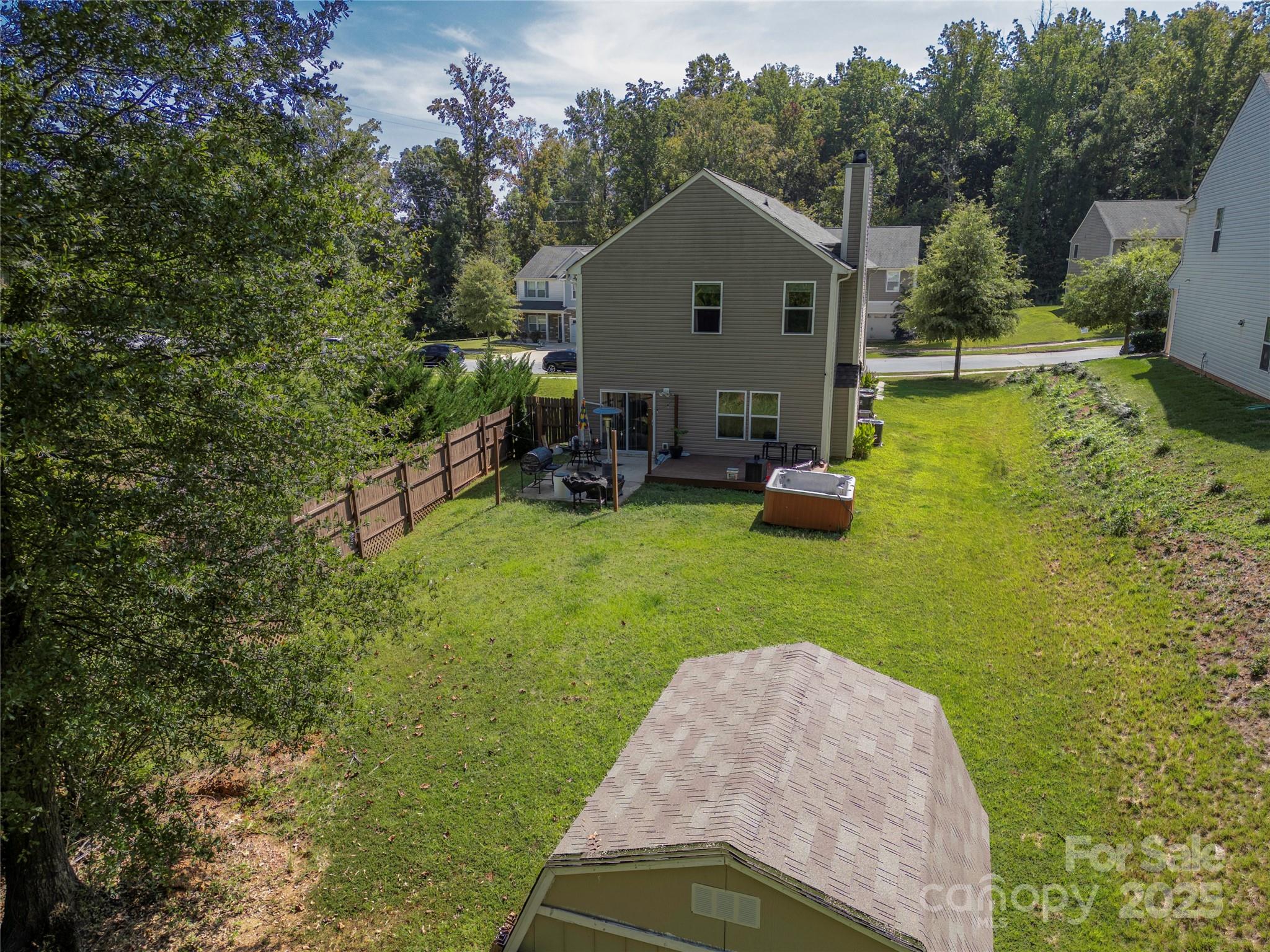 7017 Whitewater Loop Lowell, NC 28098 - Photo 21 of 24 a view of a house with a yard and sitting area