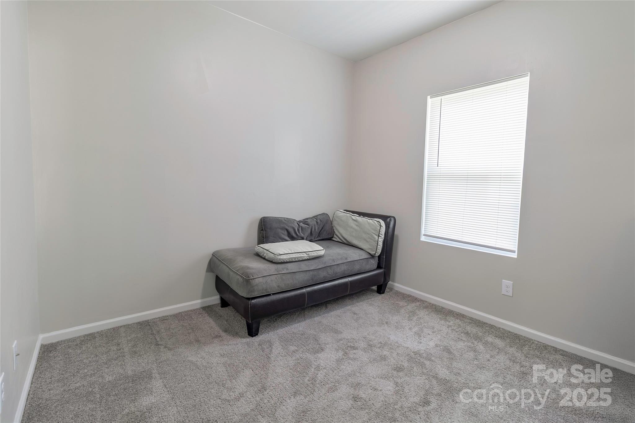 7017 Whitewater Loop Lowell, NC 28098 - Photo 6 of 24 a living room with furniture and a window