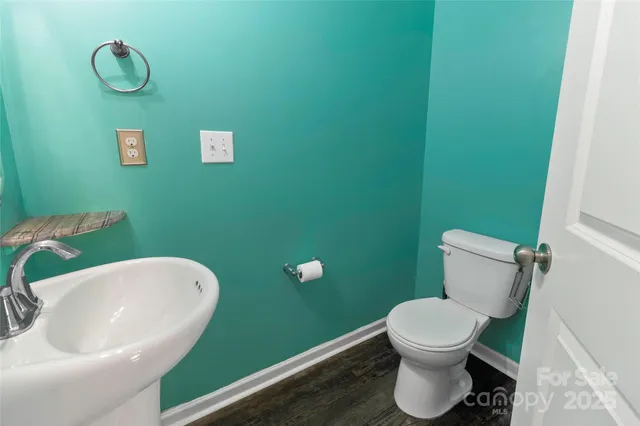 a bathroom with a toilet and a sink