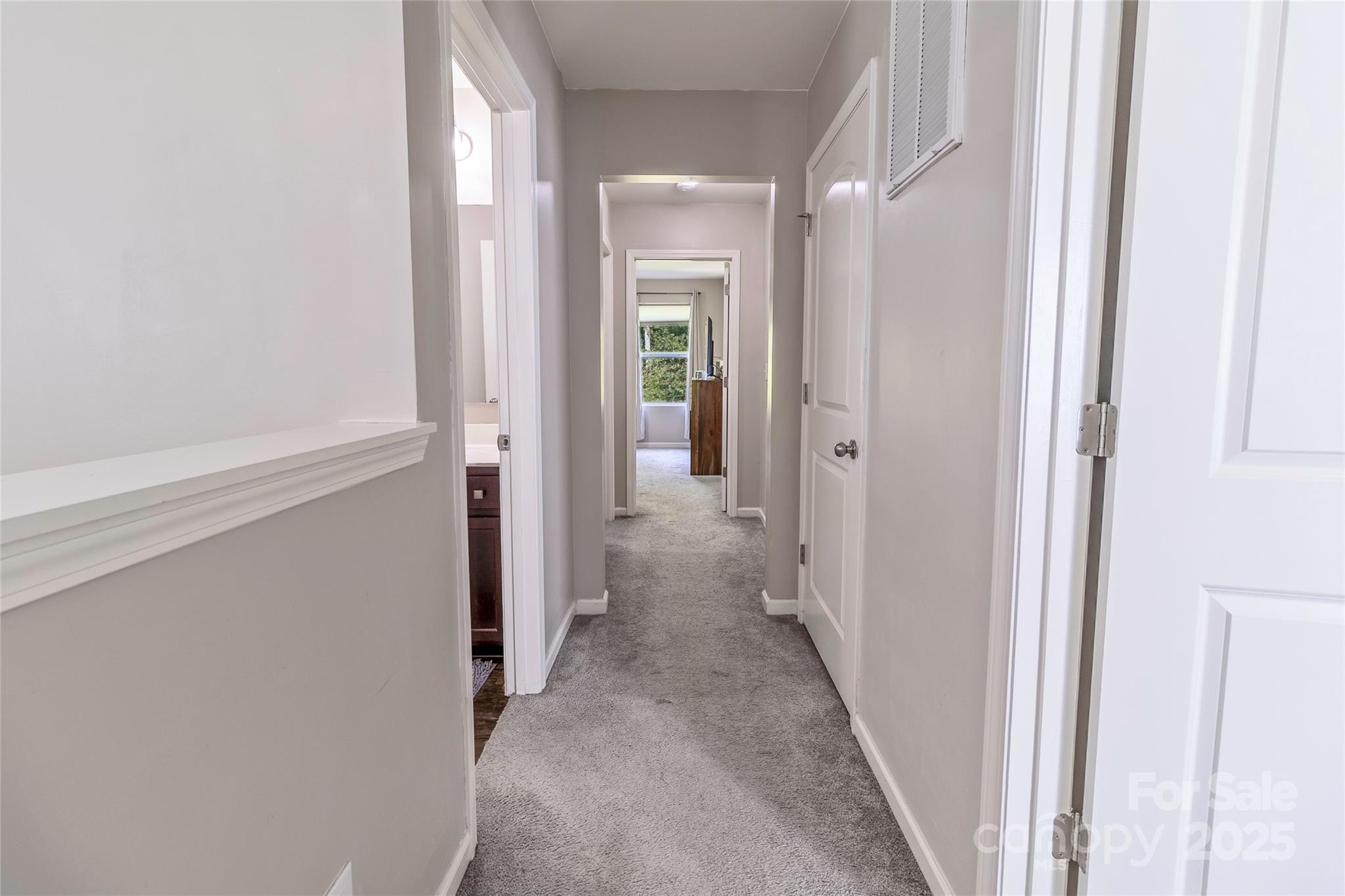 7017 Whitewater Loop Lowell, NC 28098 - Photo 10 of 24 a view of a hallway with wooden floor