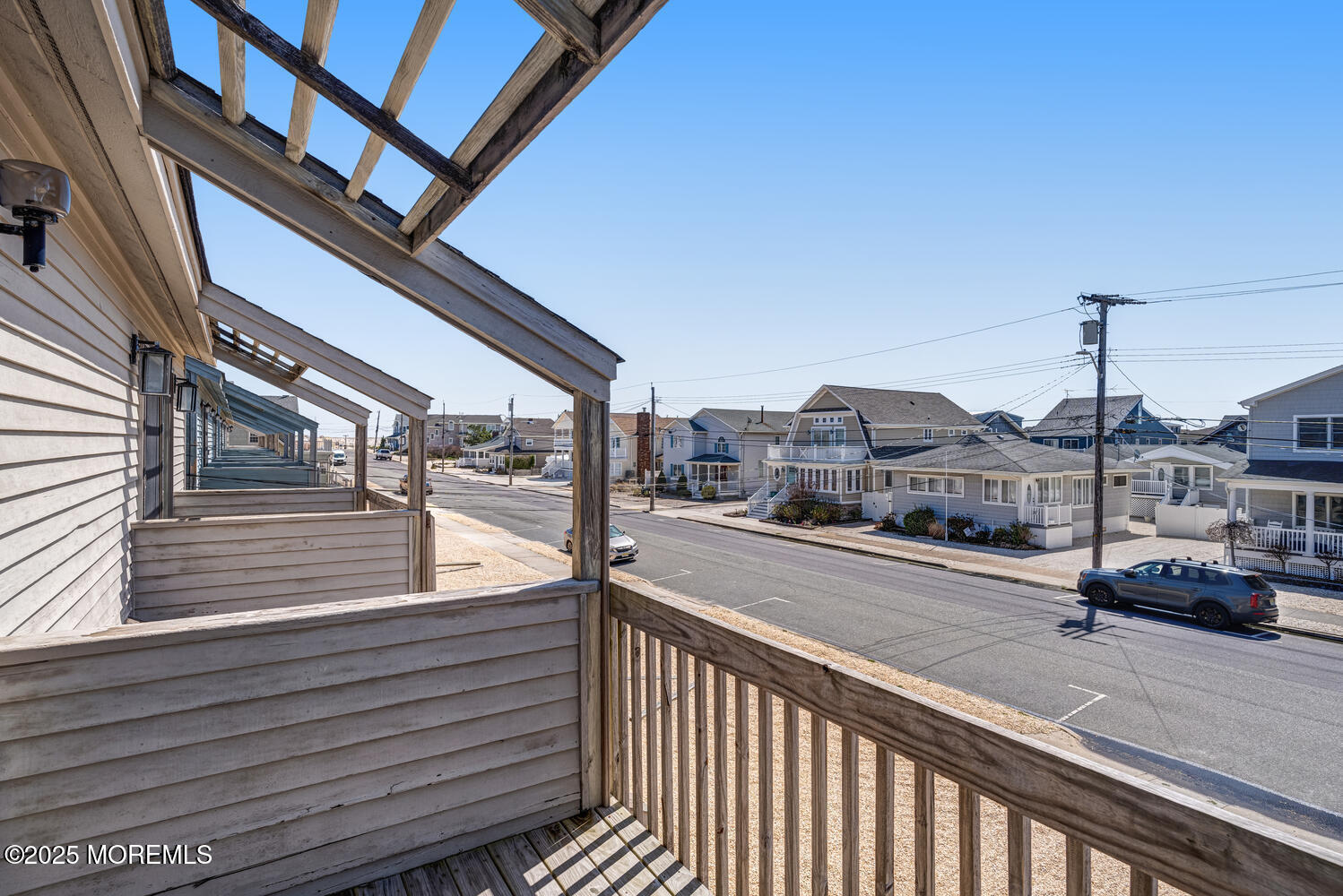 21 Brown Avenue, Unit 1 Lavallette, NJ 08735 - Photo 12 of 28 a city view with car parked on street