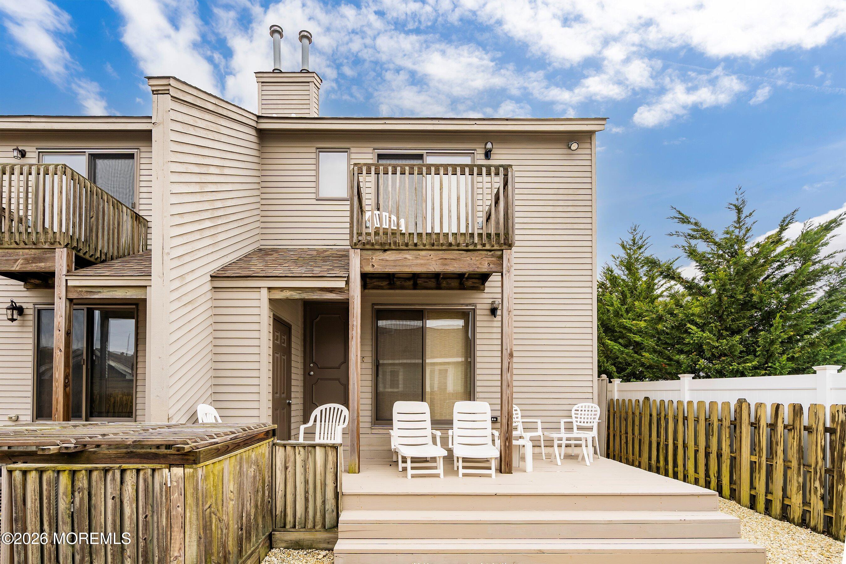 21 Brown Avenue, Unit 1 Lavallette, NJ 08735 - Photo 18 of 28 a front view of a house with a porch