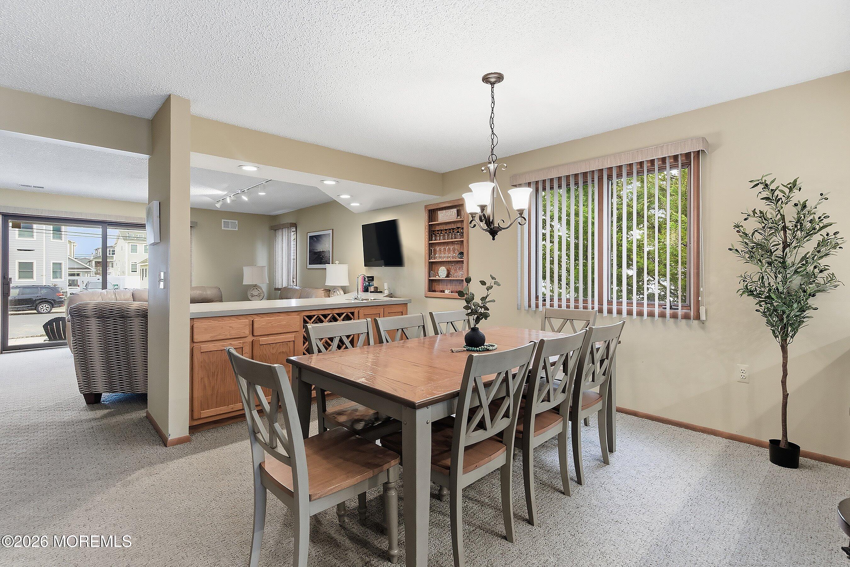 21 Brown Avenue, Unit 1 Lavallette, NJ 08735 - Photo 6 of 28 a view of a dining room with furniture window and wooden floor