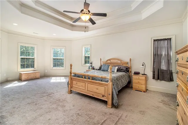 a spacious bedroom with a bed and window
