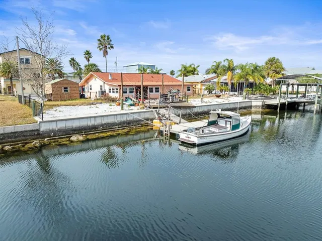 a view of a swimming pool with outdoor seating