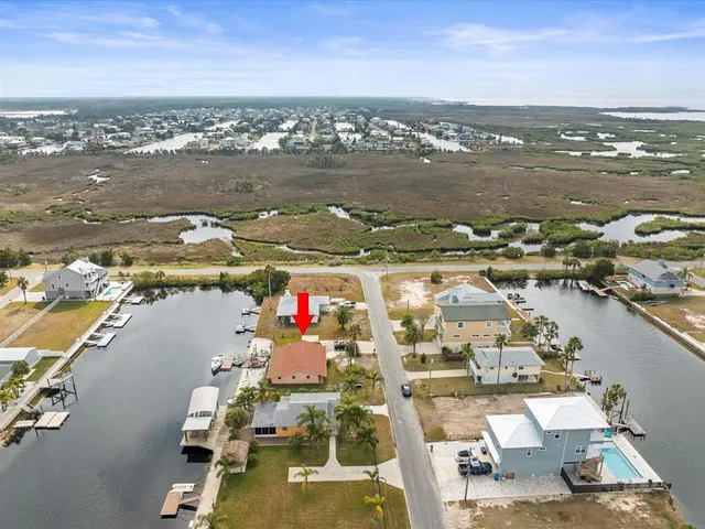 an aerial view of a city with lawn chairs