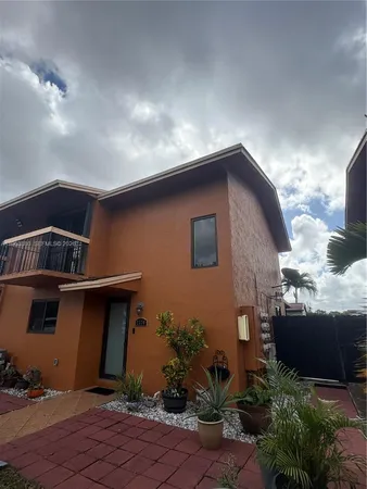 a front view of a house with yard