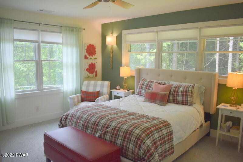 549 Finn Swamp Road Lakeville, PA 18438 - Photo 17 of 35 a bedroom with a bed and a large window