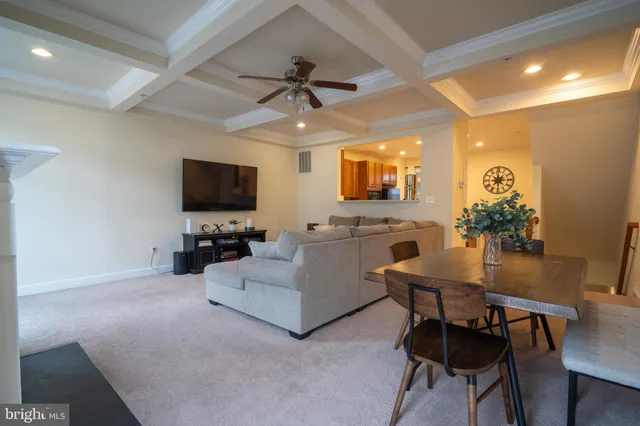 a view of a livingroom with furniture and a flat screen tv