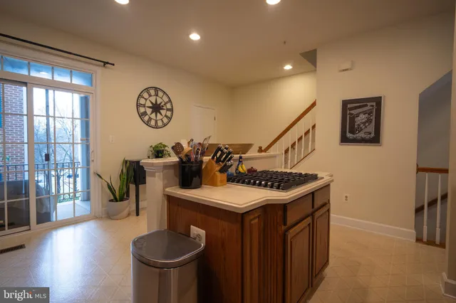 a kitchen that has a stove and a table