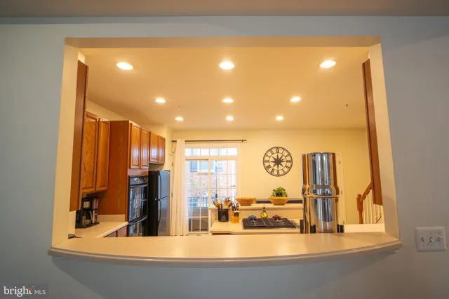 a view of a living room with floor to ceiling window