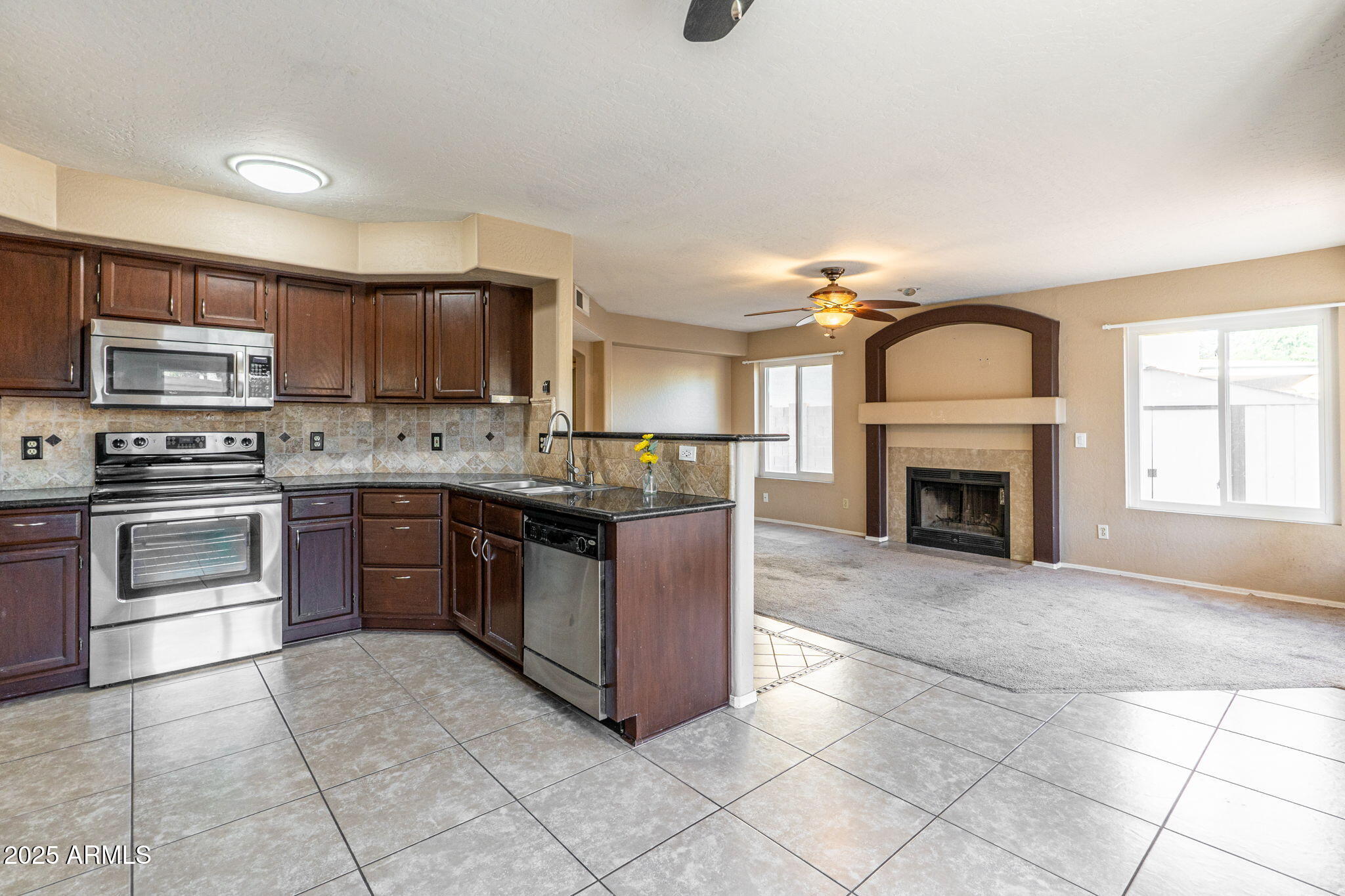 15601 South 37th Way Phoenix, AZ 85048 - Photo 11 of 38 a large kitchen with cabinets and steel stainless steel appliances