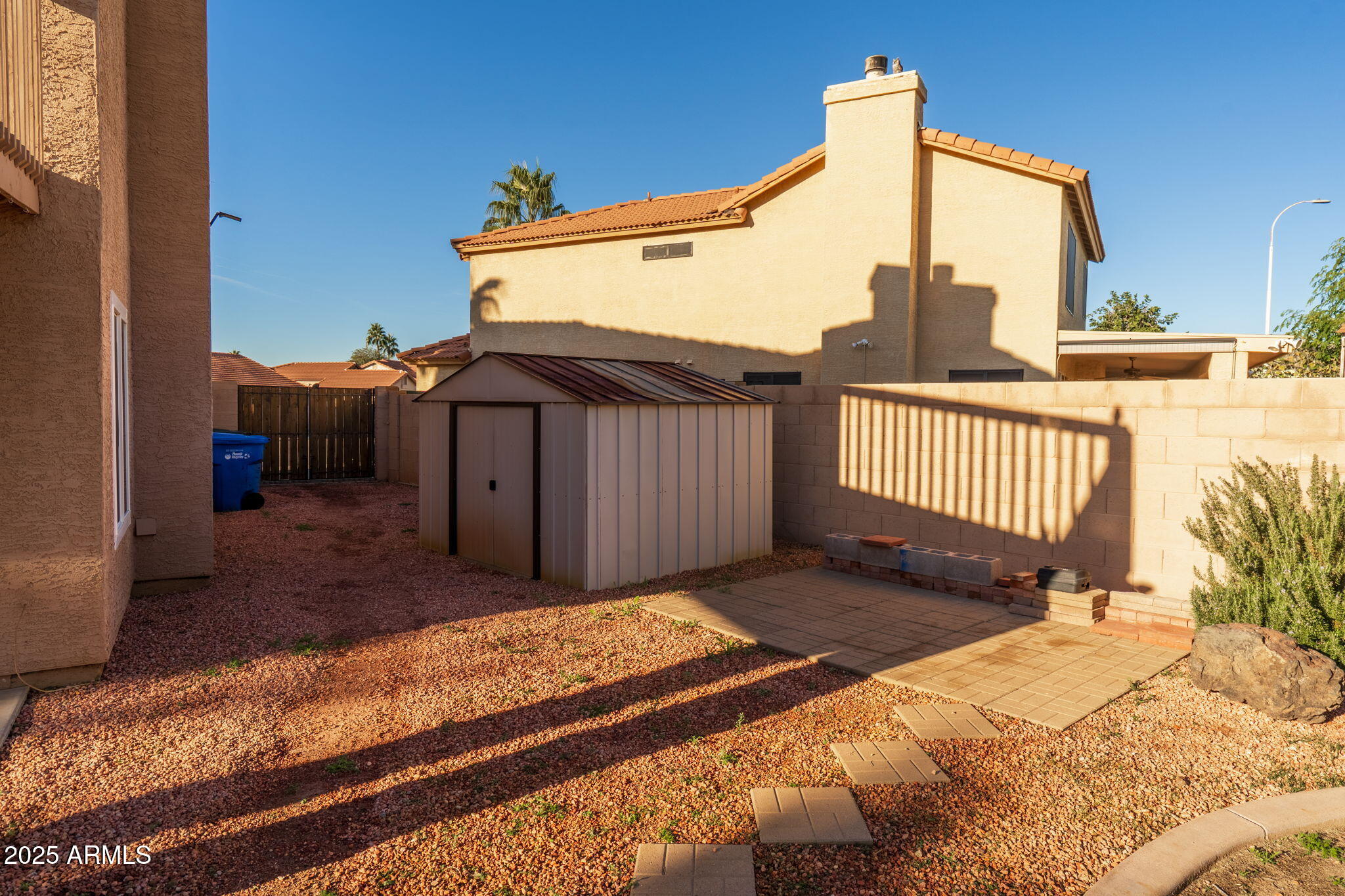 15601 South 37th Way Phoenix, AZ 85048 - Photo 15 of 38 a view of a house with a wooden fence