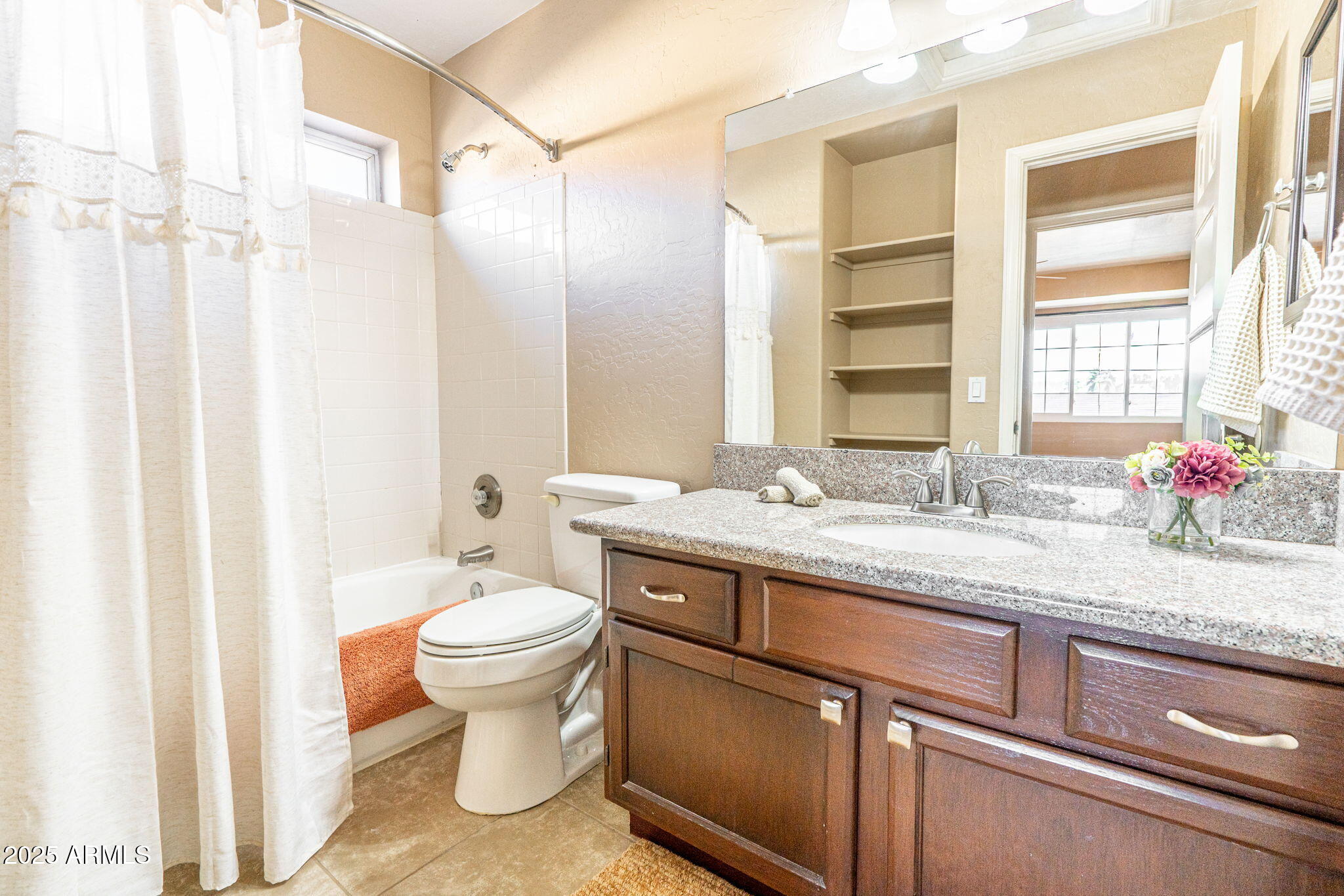 15601 South 37th Way Phoenix, AZ 85048 - Photo 21 of 28 a bathroom with a granite countertop sink a toilet and a shower