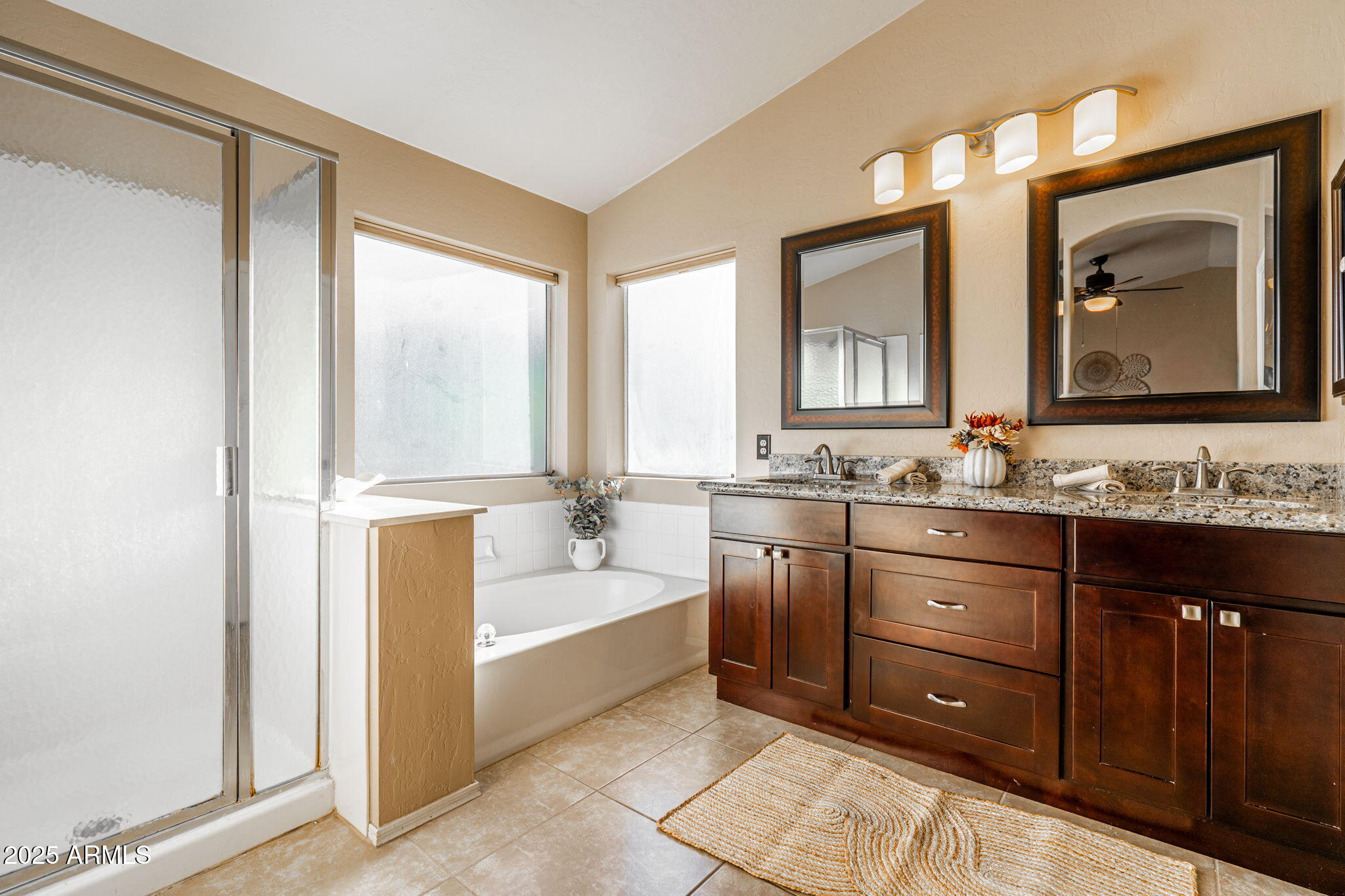15601 South 37th Way Phoenix, AZ 85048 - Photo 21 of 38 a bathroom with a granite countertop sink mirror and bathtub
