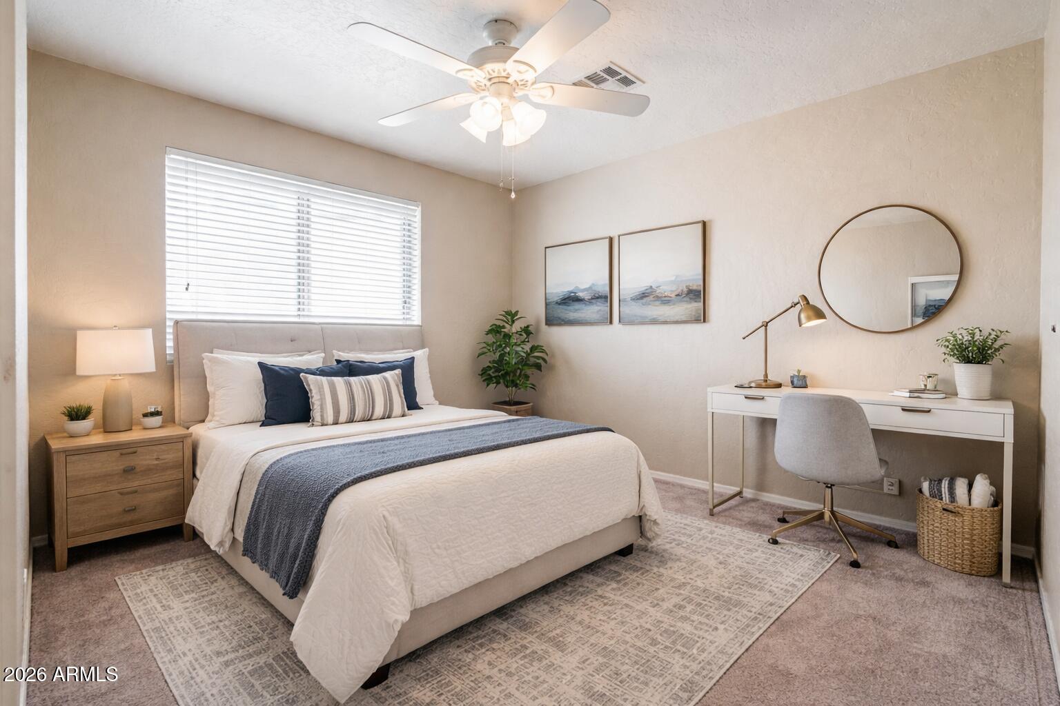 15601 South 37th Way Phoenix, AZ 85048 - Photo 24 of 38 a bedroom with a bed a mirror and a window