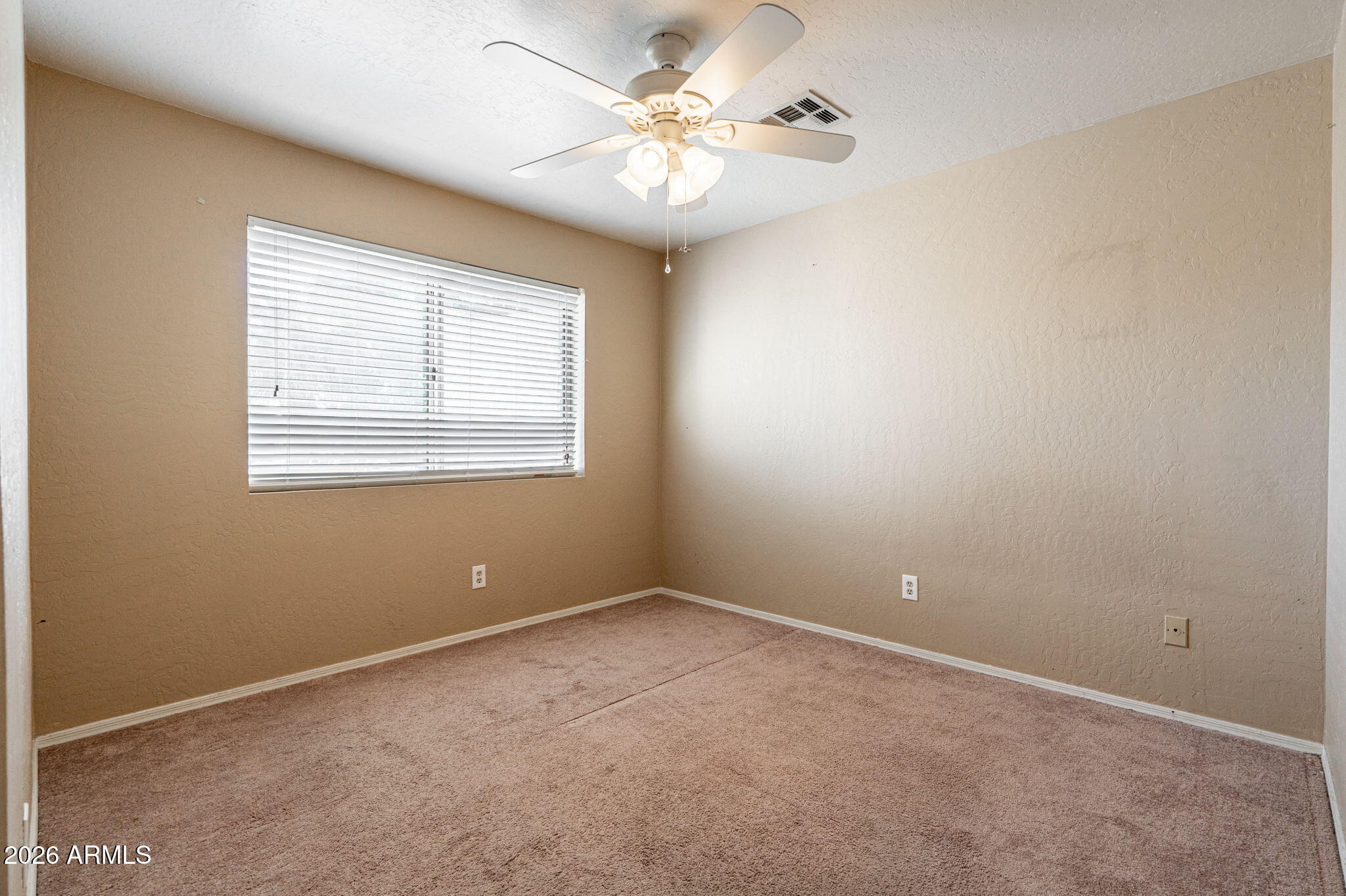 15601 South 37th Way Phoenix, AZ 85048 - Photo 25 of 38 a view of an empty room with a window