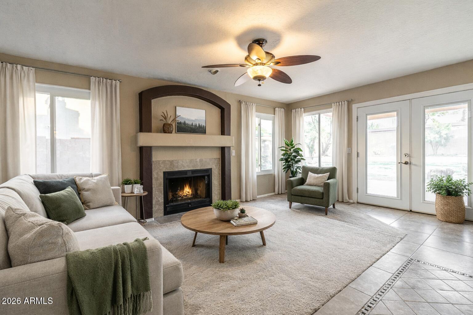 15601 South 37th Way Phoenix, AZ 85048 - Photo 6 of 38 a living room with furniture a window and a fireplace