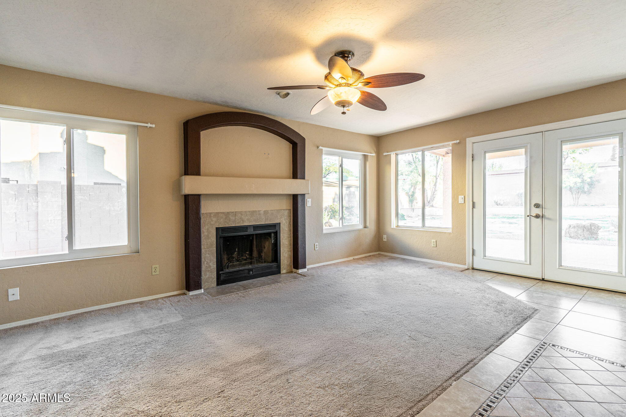 15601 South 37th Way Phoenix, AZ 85048 - Photo 7 of 38 a view of an empty room with window and fire place