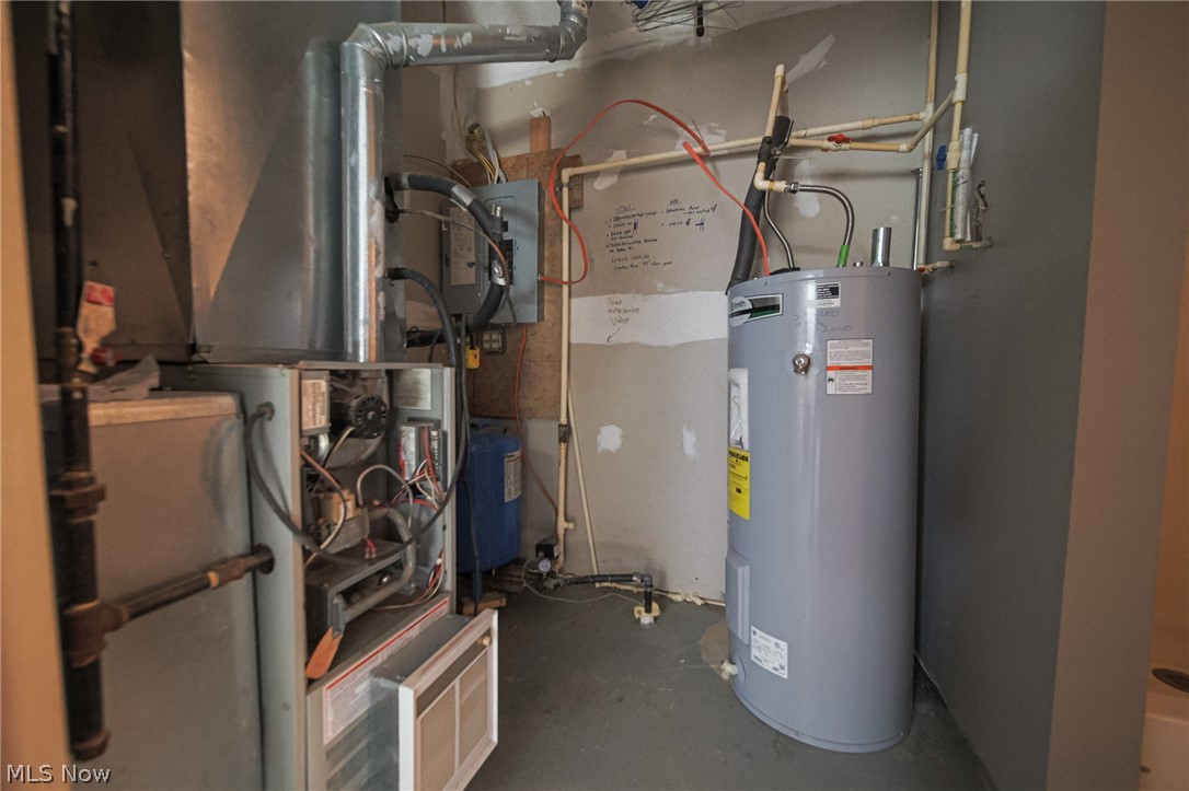 Plum Road Kimbolton, OH 43749 - Photo 9 of 50 Utility room featuring heating unit and water heater