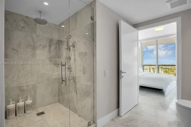 a bathroom with a bathtub and a shower