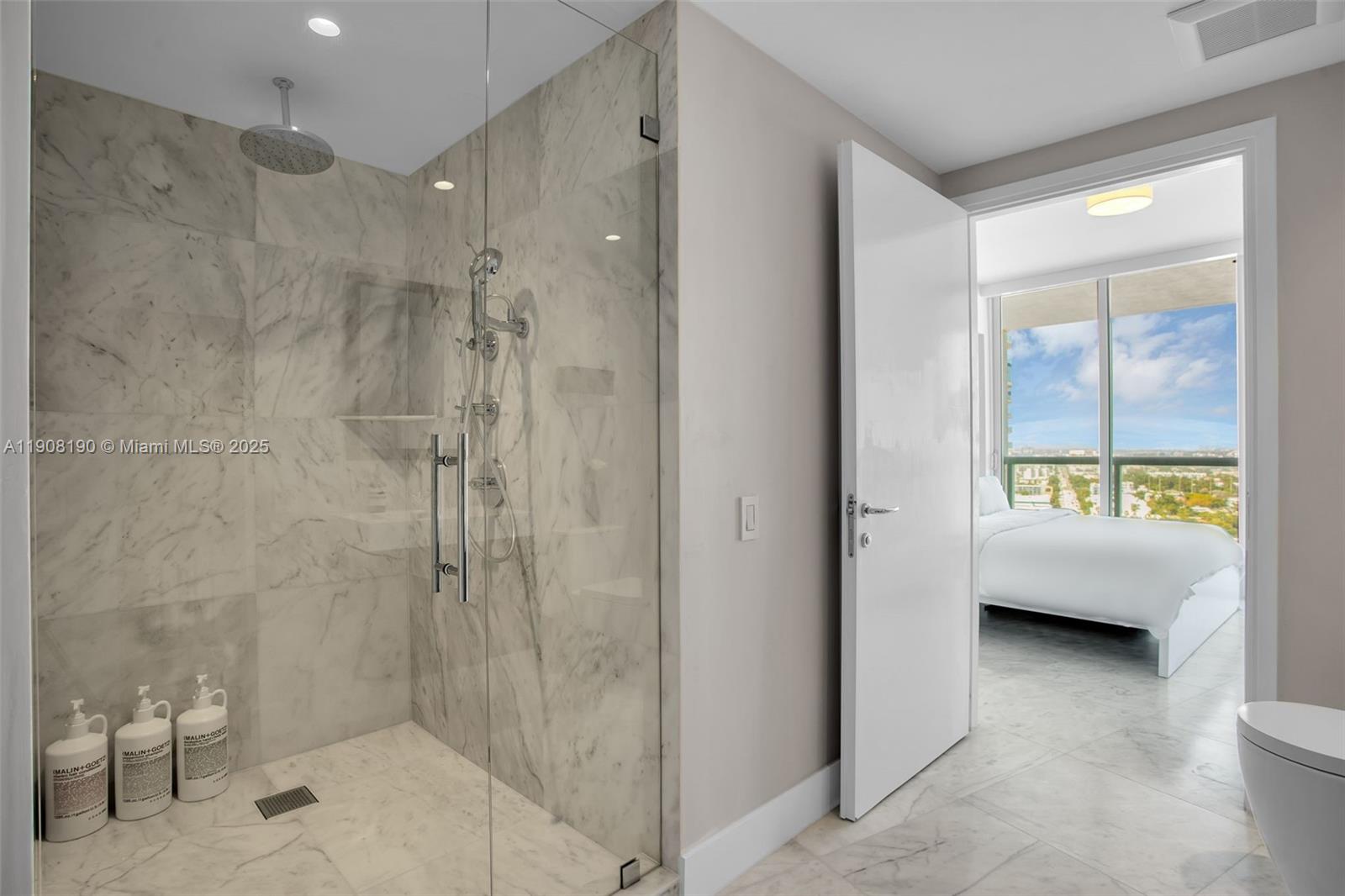 450 Alton Road, Unit 2110 Miami Beach, FL 33139 - Photo 16 of 33 a bathroom with a bathtub and a shower