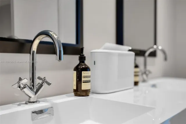a bathroom with a glass shower door