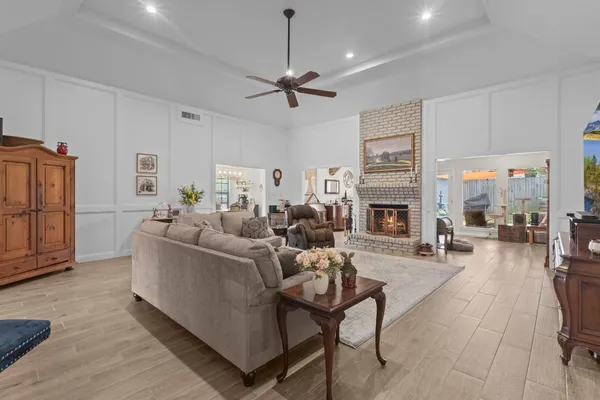 a living room with furniture and a fireplace