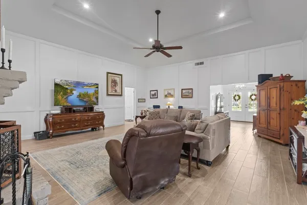 a living room with furniture and a fireplace